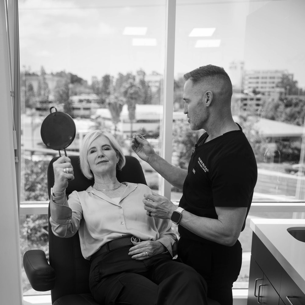 Dr. Taylor Pollei consulting with a brow lift patient