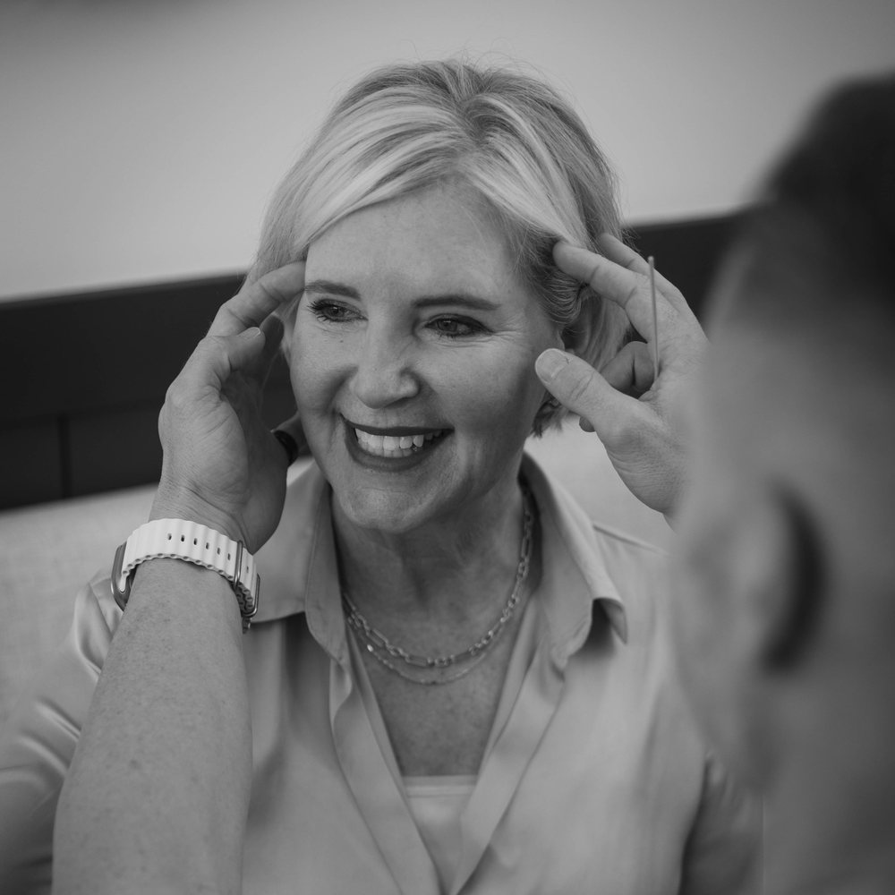 Dr. Taylor Pollei consulting with an eyelid surgery patient